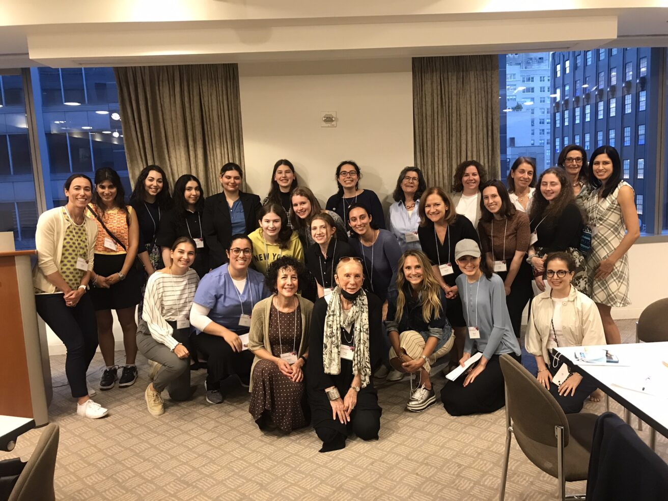 A group of women posing for a photo in a conference room at CUNY Hillel's Career Connect event.