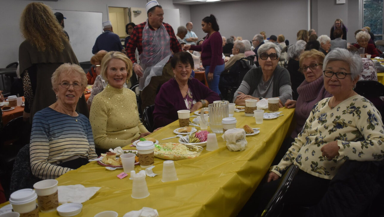 A group of people sitting at a table.